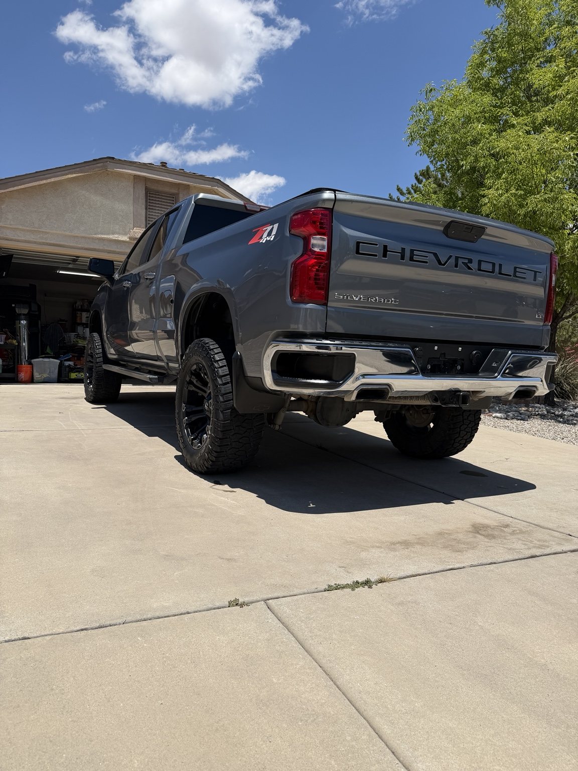 Low rear view of a clean silver Chevrolet Silverado pickup