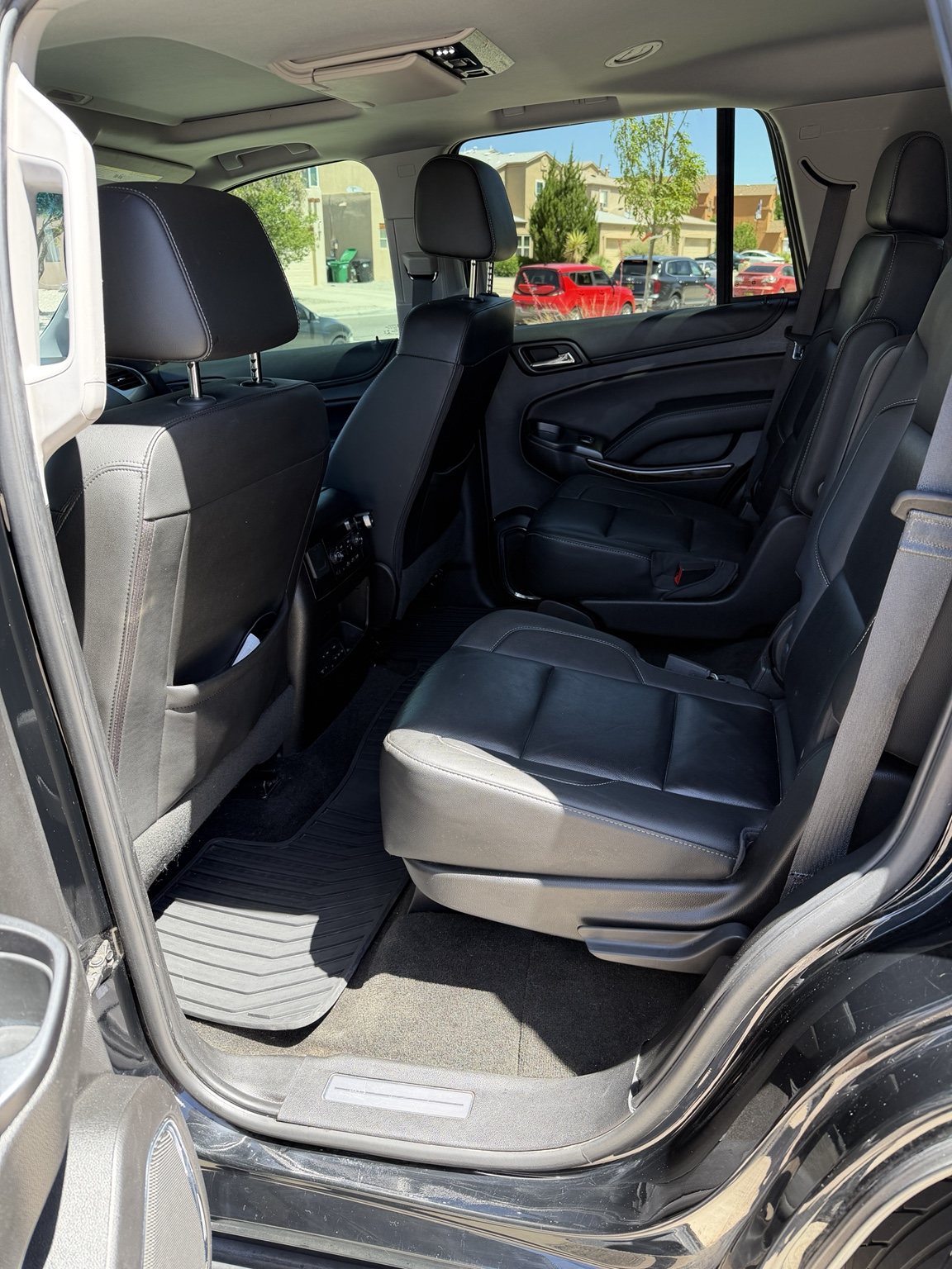 Wide view of a restored Chevrolet Tahoe cabin with black seating